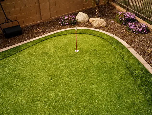 Backyard golf green installation from Outdoorscapes