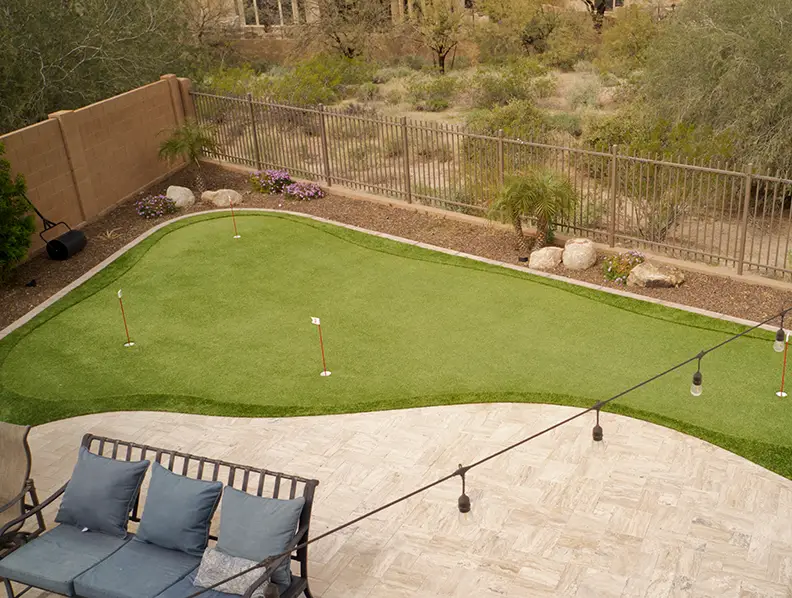 Backyard golf green installation from Outdoorscapes